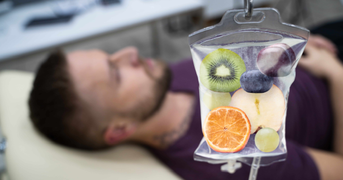 Patient receiving IV Therapy in Grand Blanc, MI with a nutrient-rich infusion featuring fruits for hydration and wellness.
